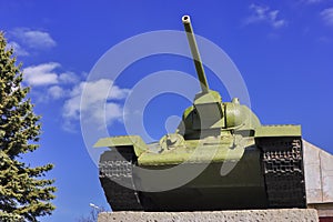 Soviet tank T-34 at war in the second world war on a blue sky background