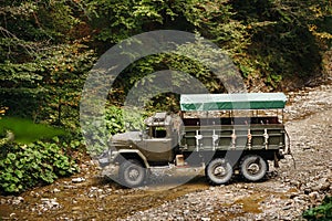 Soviet truck in the Carpathian Mountains carries people on excursions photo