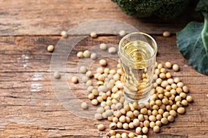 Soy bean and soy oil on table