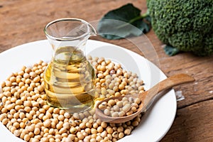 Soy bean and soy oil on table