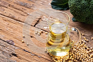 Soy bean and soy oil on table