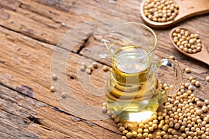 Soy bean and soy oil on table