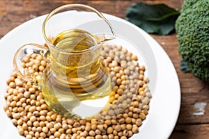 Soy bean and soy oil on table