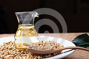 Soy bean and soy oil on table