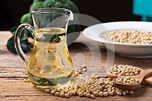 Soy bean and soy oil on table