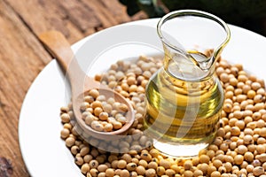 Soy bean and soy oil on table