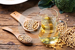 Soy bean and soy oil on table