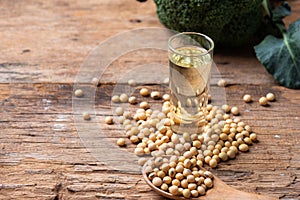 Soy bean and soy oil on table