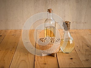 Soy bean and soy oil on a wooden table