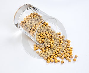 soy beans in glass isolated on white