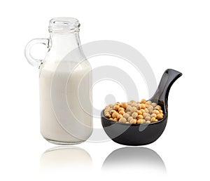 Soy beans , soy milk in glass bottle isolated
