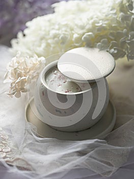 Soy candle in a concrete, plaster candlestick, decor interior. Home decoration with a burning scented candle. Gypsum
