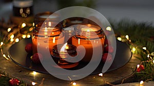 Soy candles burn in glass jars. Comfort at home. Candle in a brown jar. Scent and light. Scented handmade candle. Aroma