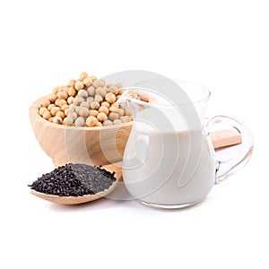 Soy milk in a glass jar and soybeans, black sesame Isolated on w