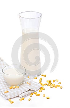 Soy milk with soy bean on white background