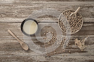 Soy milk and soy bean on wooden background