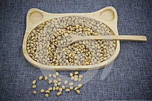 Soy milk in wood dish .