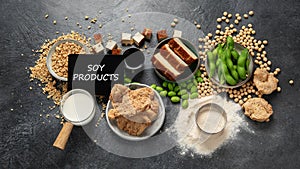 Soy products on black background. Vegan healthy food