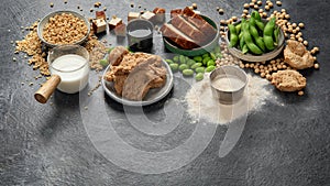 Soy products on black background. Vegan healthy food