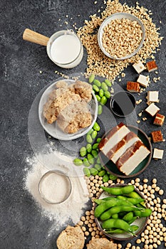 Soy products on black background. Vegan healthy food