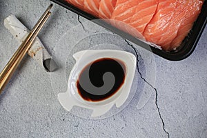 Soy sauce in a bowl for dipping sashimi and shushi, popular Japanese food.