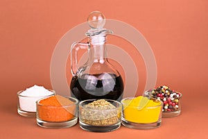 Soy sauce in a decanter and various spices. Close-up.