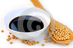 Soya beans with dark soy sauce in a ceramic bowl isolated over white background. Copy Space