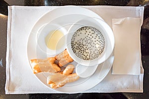 Soybean milk with deep-fried dough stick and black sesame seeds
