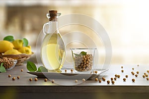 Soybean oil in botlle and dry soy beans in kitchen