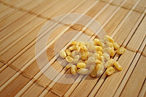 Soybeans on a background of brown wooden