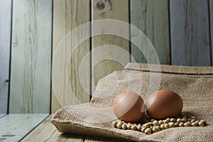 Soybeans and egg on the hessian bags . (Still life Style)