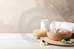 Spa accessories on white wooden background
