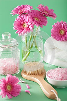 Spa aromatherapy with gerbera flowers saltl brush