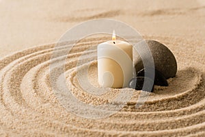 Spa atmosphere candle zen stones in sand