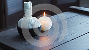 Spa background. Candles, massaging stones and herbal balls. Massage, oriental therapy, wellbeing and meditation.