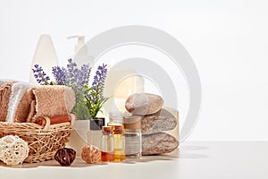 Spa background. Cosmetic creams, natural oils, towels on white background with copy space. Healthy lifestyle, spa, body care