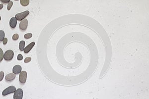 Spa background with grey stones, gray modern background, cover, template with round gray stones, flat lay. Copy space for your