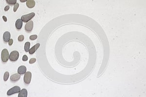 Spa background with grey stones, gray modern background, cover, template with round gray stones, flat lay. Copy space for your