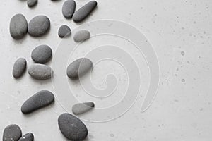 Spa background with grey stones, gray modern background, cover, template with round gray stones, flat lay. Copy space for your