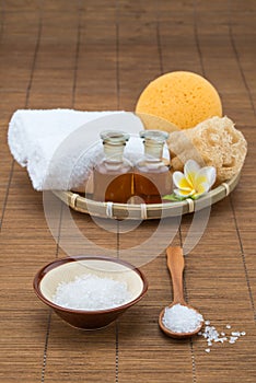 Spa bath, salt bowl spoon, towel sponge essential oil and flower