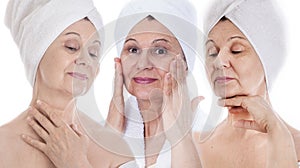 Spa and beauty concept. Aged good looking woman with white towel on her head. UK