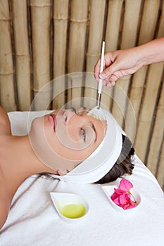 Spa beauty facial treatment oil brush and flowers