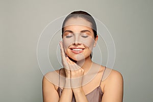 Spa beauty portrait. Beautiful spa woman touching her face. Perfect healthy clean skin
