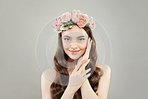 Spa beauty portrait of beautiful woman with clear skin, healthy hair wearing flowers wreath