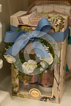 Spa and beauty products hampers on display on shelves for sale in luxury boutique photo