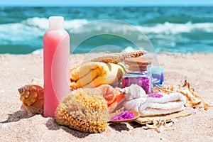 Spa beauty products: towels, soap, shells, sea salt on the sea c