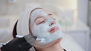 spa and beauty salon, woman is enjoying face mask in beauty clinic