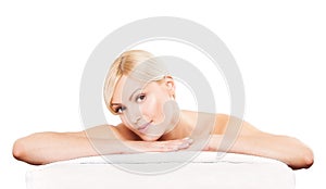 Spa beauty skin treatment woman on white towel.