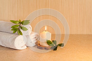 Spa, beauty and wellness background. Towel, leaf and candle