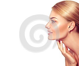 Spa blonde woman touching her face